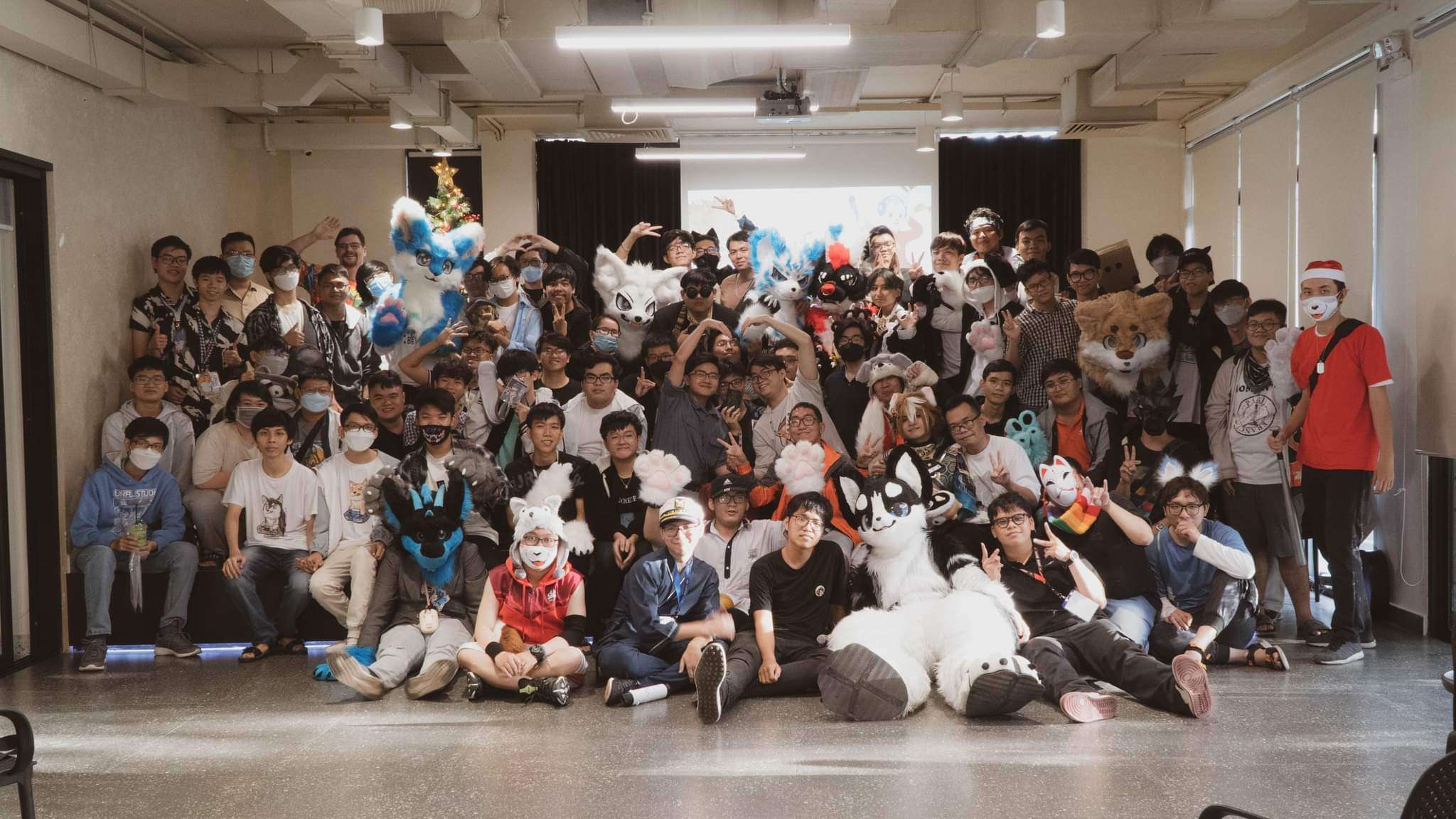 Furry community members gathered together in colorful fursuits, representing an intergenerational fandom gathering with different participation rules for different age groups.
